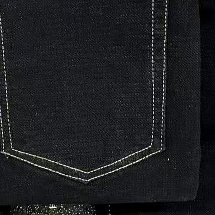 Close-up of contrast stitching on black denim